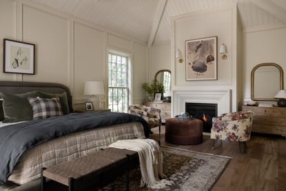 a bedroom with storage on either side of a fireplace