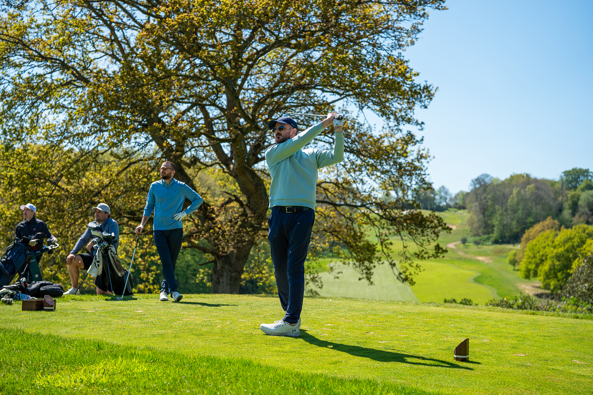 Baz Plummer hitting a tee shot on a par-3
