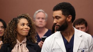 Kelly McCreary and Anthony Hill as Maggie and Winston awkwardly looking at each other in an elevator in Grey's Anatomy season 19