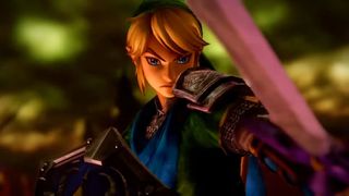 Hyrule Warriors trailer screenshot showing Link, a blond male character wearing green cloth amor with metal plated shoulders while wielding the Master Sword