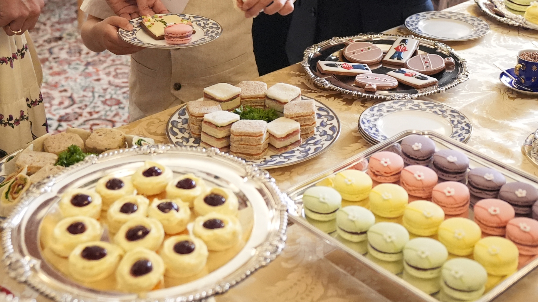 A close-up of food during a tea party and treasure hunt hosted by Queen Camilla at Clarence House for children supported by Dreams and Wishes