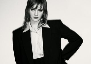 Phia Saban black and white photo wearing a suit.