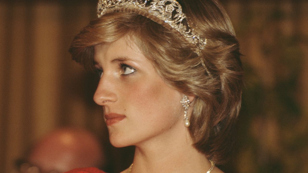 Princess Diana&#039;s bulimia struggles appear apparent in photo of her face looking thin. She is wearing the Spencer family tiara and pearl and diamond earrings which were a gift from the Emir of Qatar.