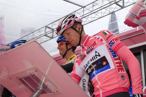 Ryder Hesjedal signing up in his pink jersey