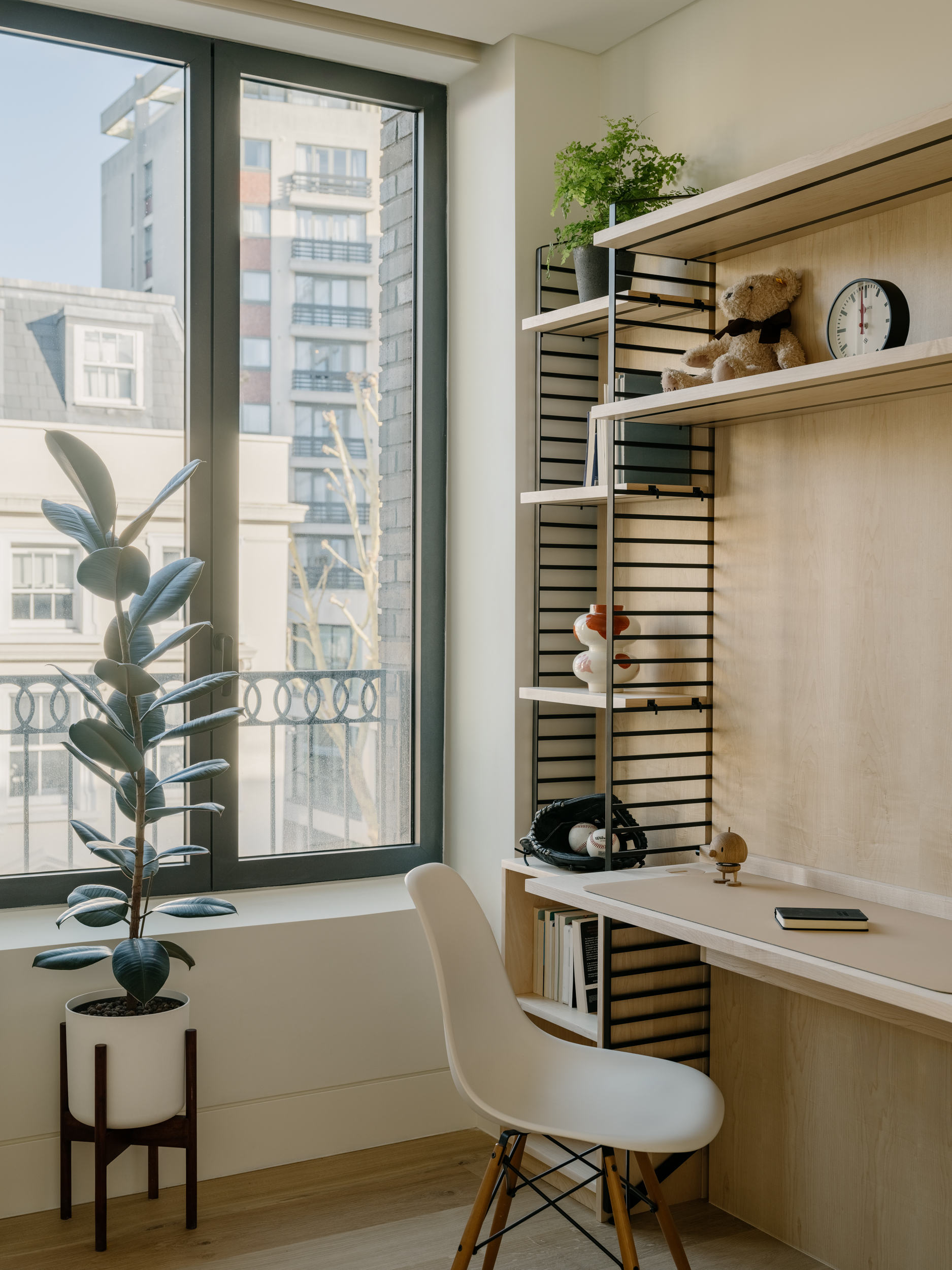 Bespoke joinery abounds, including these adjustable desks