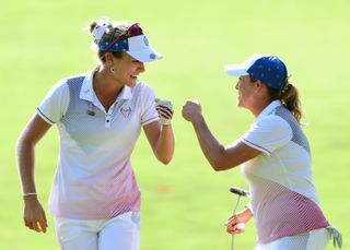 Christie Kerr and Lexi Thompson fist bump at the Solheim Cup