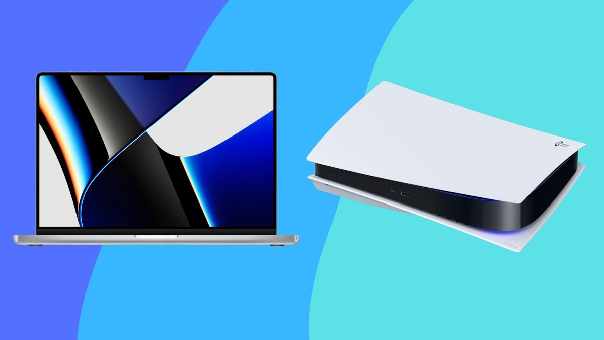 The MacBook Pro 14-inch (2021) next to a Sony PlayStation 5 on a blue backdrop