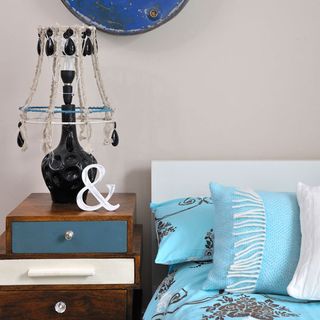 bedroom with table lamp and bed linen