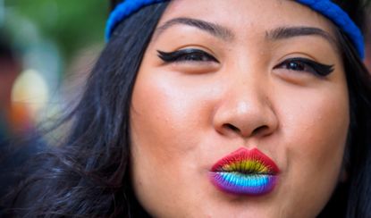 United States, Washington, Seattle Gay Pride Parade, June 28th, 2015. Woman with rainbow colored lips. MR.