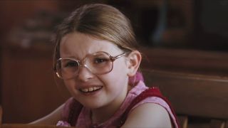 Abigail Breslin wearing glasses and making a face at the dinner table in Little Miss Sunshine.