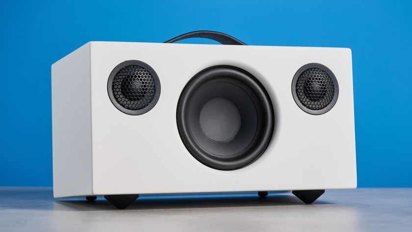Audio Pro C5 MKII Bluetooth speaker in white photographed on a blue background