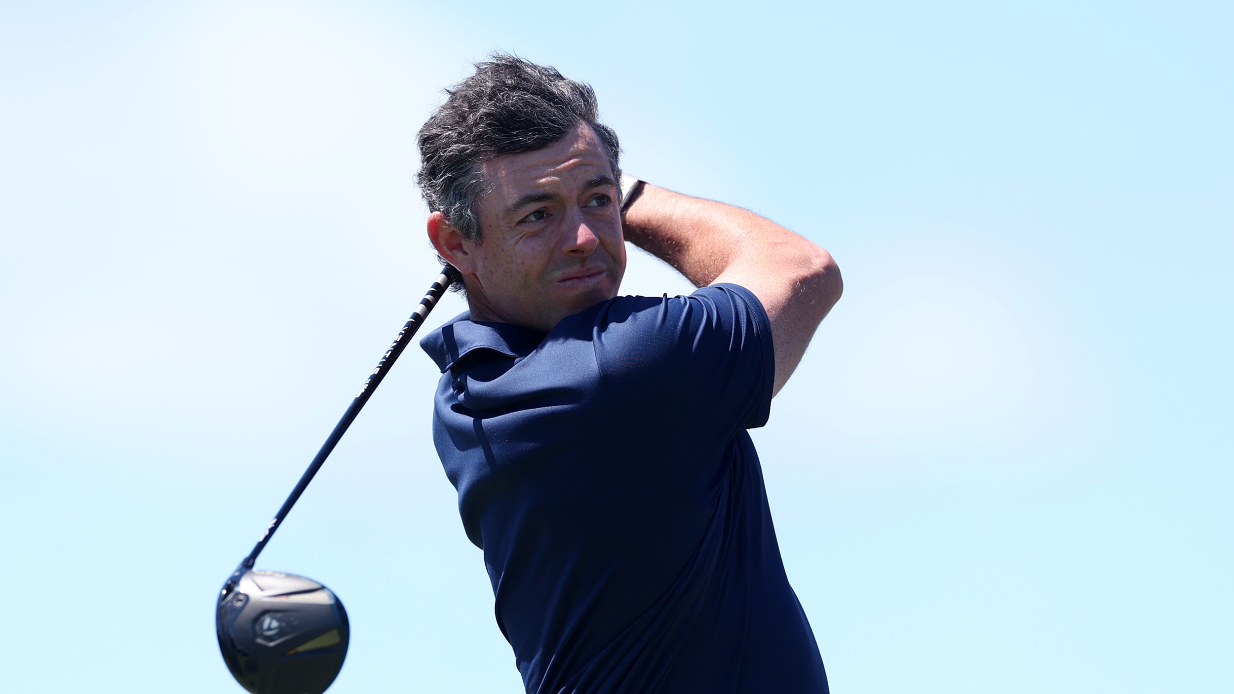 Rory McIlroy hitting a driver at Shinnecock Hills ahead of the 2026 US Open