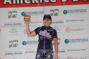 Laura Van Gilder on the top of the podium representing Mellow Mushroom in the team's competition