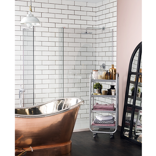 bathroom with white monochrome wall and copper colour bathtub