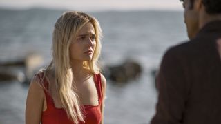 Emily Alyn Lind in a red dress in We Were Liars