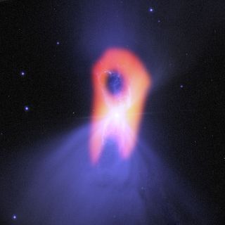 The ghostly Boomerang Nebula, called the 'coldest place in the universe,' reveals its true shape in this image from the giant ALMA radio telescope. 