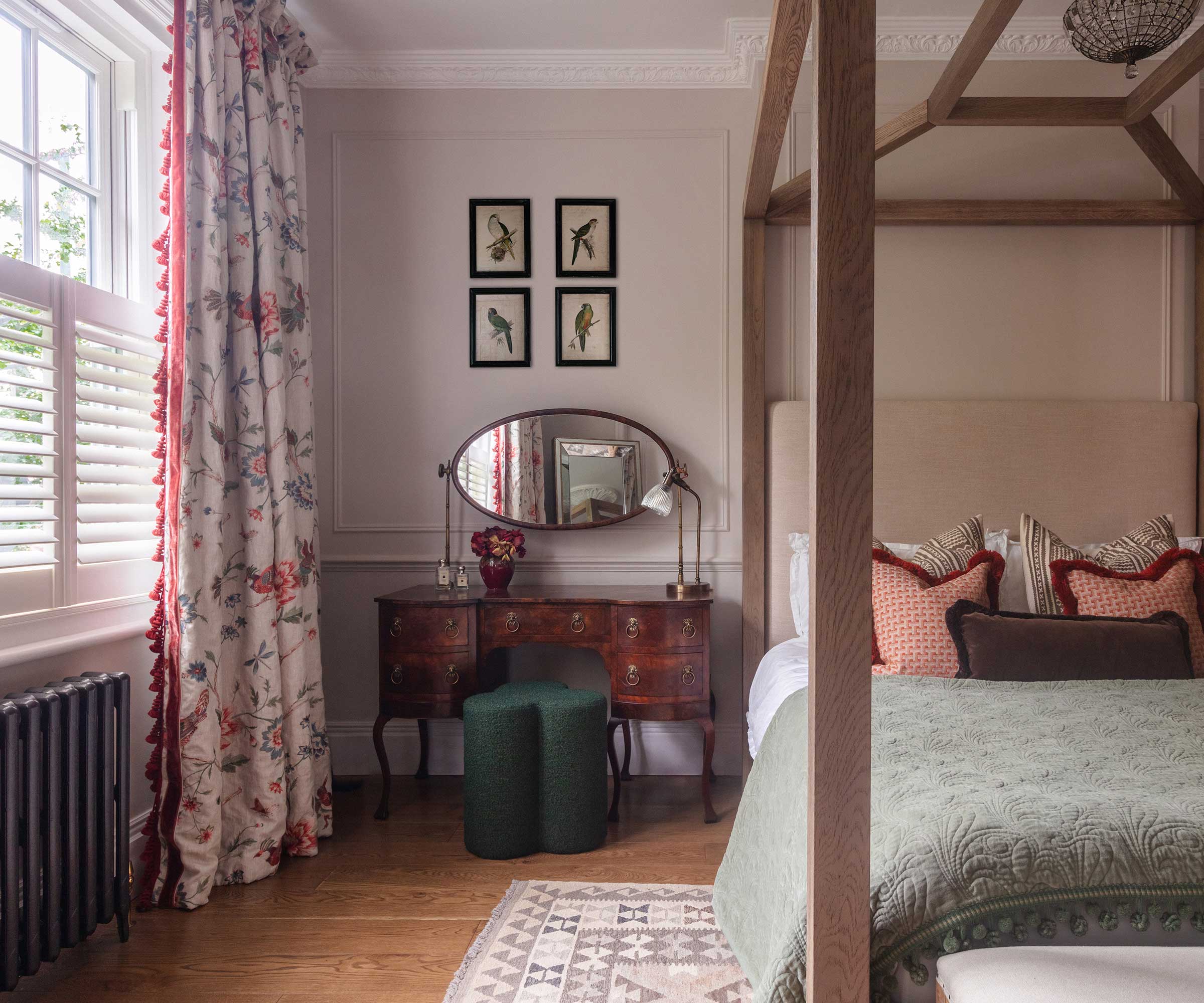 pink bedroom with engineered wood flooring and column radiator
