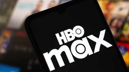 The new white HBO Max logo on a black background on a mobile phone