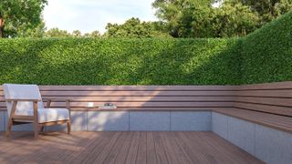 wraparound garden bench with low fence and thick hedge