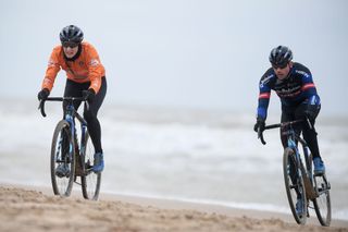 Belgian former cyclocross champion Sven Nys R and Dutch Lucinda Brand ride on a beach during a track reconnaissance and training session ahead of the world championships cyclocross cycling in Oostende on January 28 2021 The worlds are taking place this weekend Photo by DAVID STOCKMAN Belga AFP Belgium OUT Photo by DAVID STOCKMANBelgaAFP via Getty Images