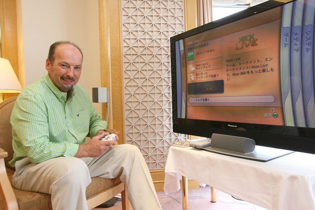 Peter Moore shows off the Xbox 360 in Japan.