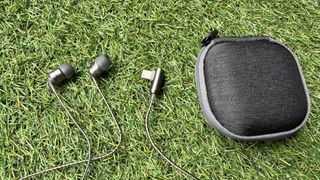 SoundMagic E80D wired USB-C hedaphones on grass and mosaic