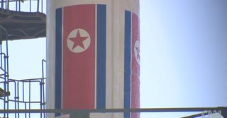 This still from a CNN broadcast shows a close-up of the flag emblazoned on North Korea's Unha-3 rocket, which country officials say will launch a satellite into orbit in April 2012.