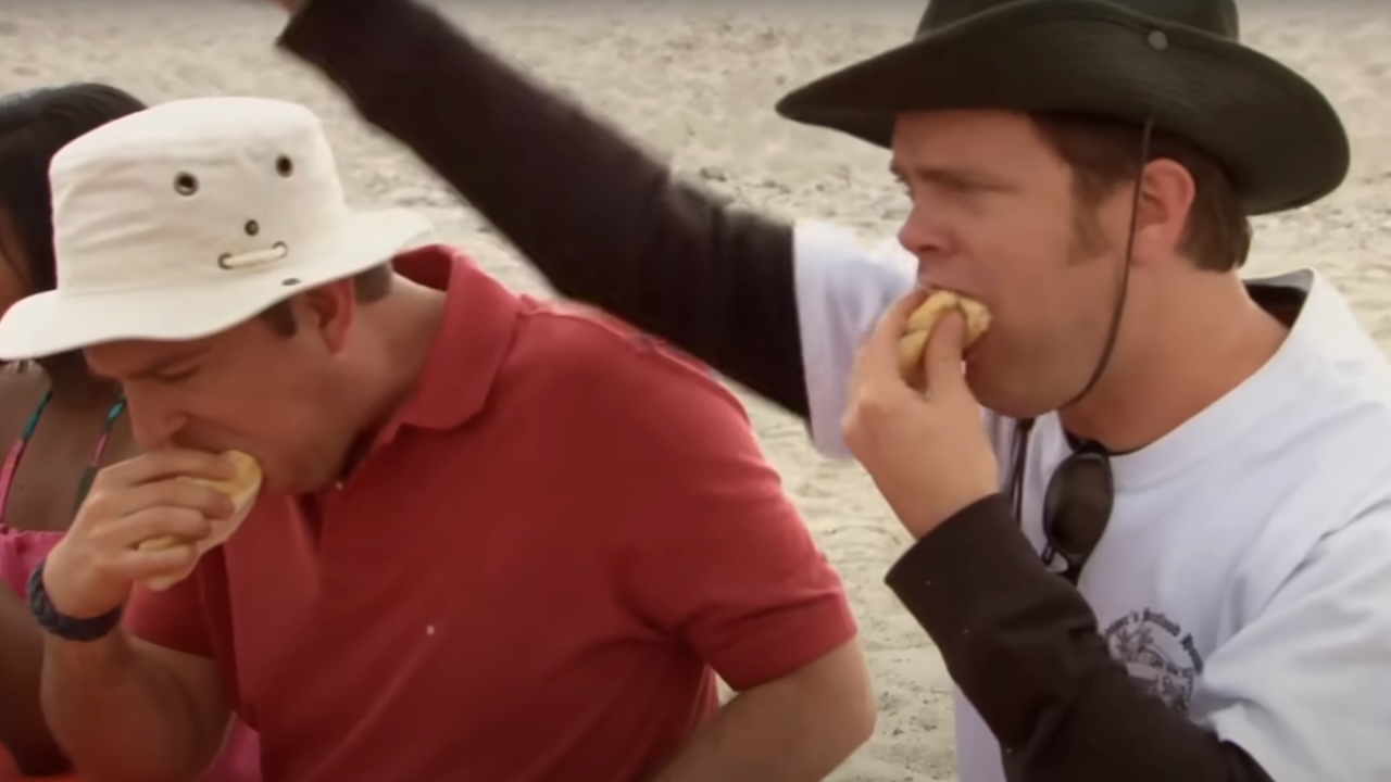 Andy and Dwight eating hot dogs in The Office