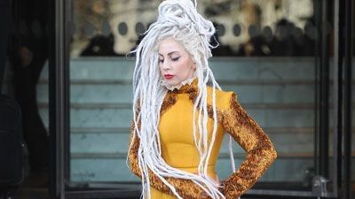 Lady Gaga dressed in yellow.