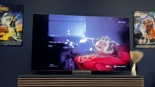 Samsung QN900D on stand in living room