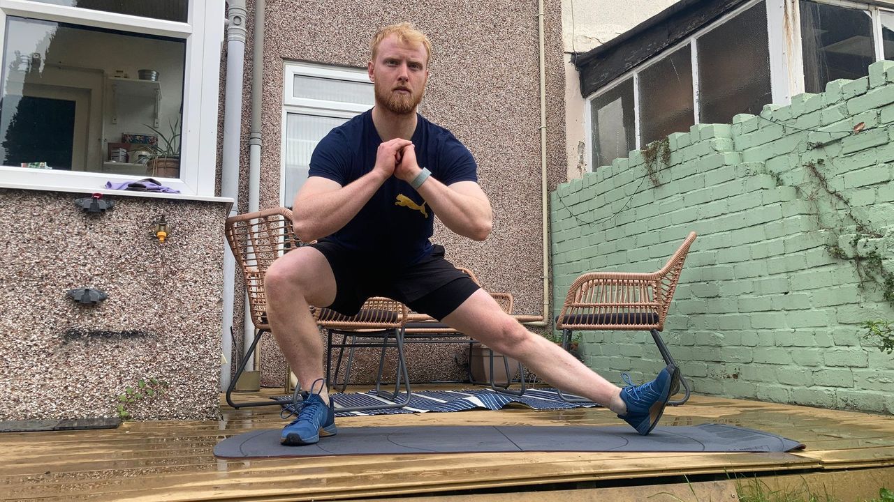 Fit&amp;Well fitness writer Harry Bullmore performing a Cossack squat