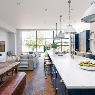 white kitchen with worktop and wooden floor