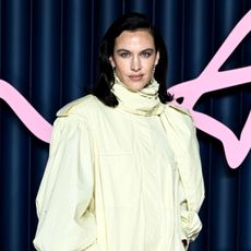 An image of Alexa Chung wearing croc-effect heels at the 2025 Fashion Awards.