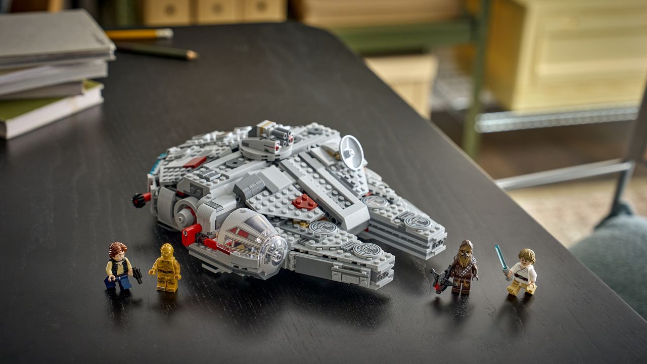 Lego Smart Play Millennium Falcon and figures on a wooden table
