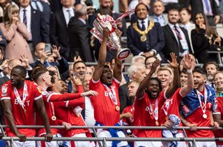 Nottingham Forest players celebrate after winning the Championship play-off final against Huddersfield Town in May 2022.