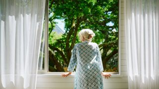 Woman looking out of the window