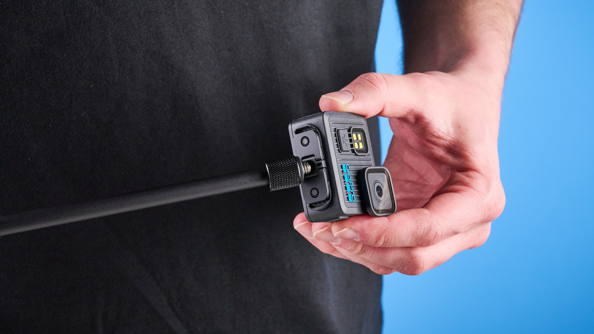 The GoPro LIT Hero against a blue background