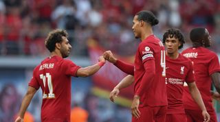 Mohamed Salah celebrates with Virgil van Dijk of Liverpool after scoring their team's first goal the pre-season friendly match between RB Leipzig and Liverpool FC at Red Bull Arena on July 21, 2022 in Leipzig, Germany.