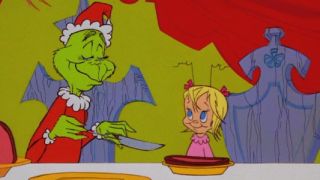 The Grinch and Cindy Lou Who in How The Grinch Stole Christmas.