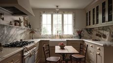 A small kitchen with marble window trim