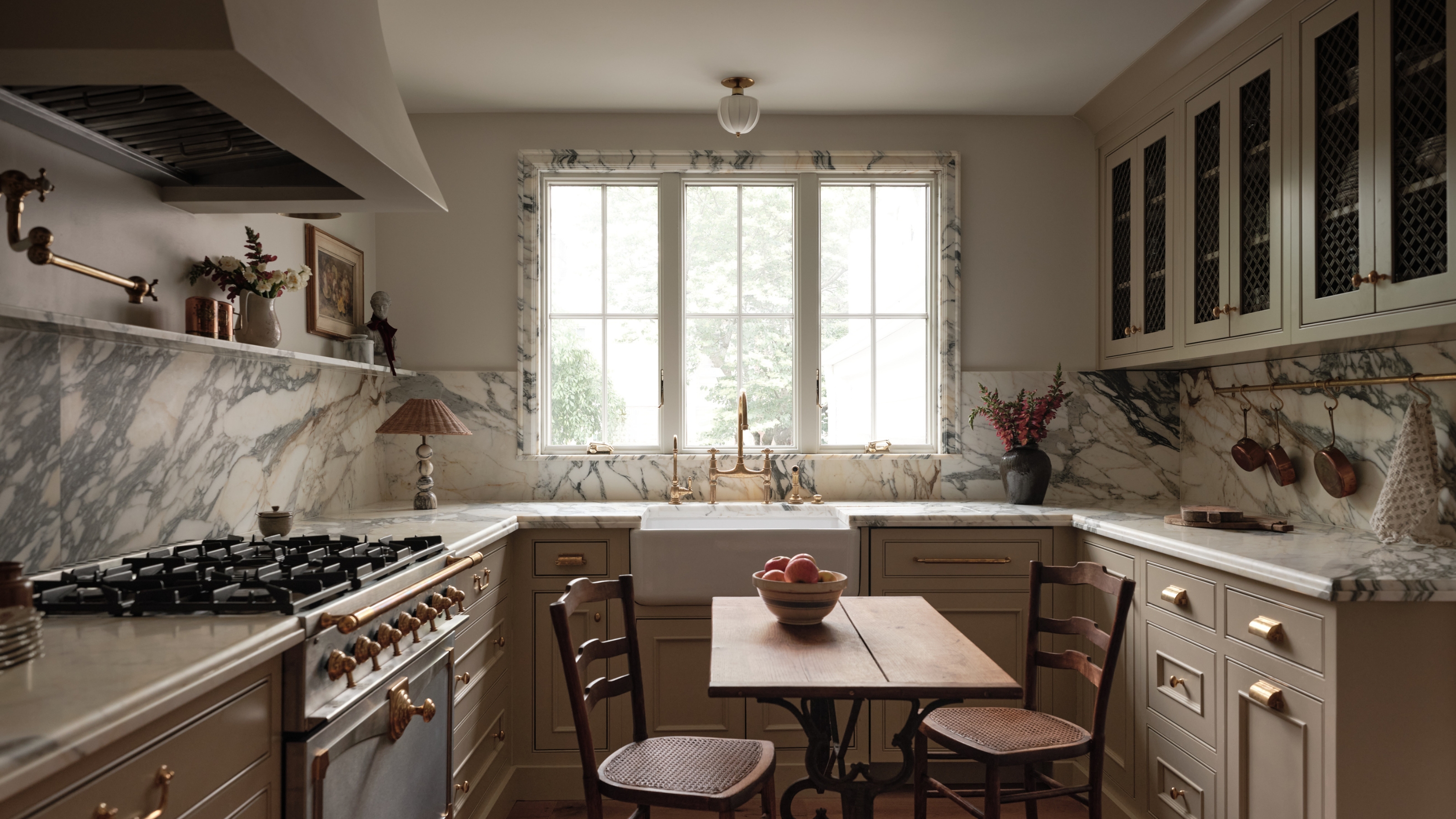 A small kitchen with marble window trim