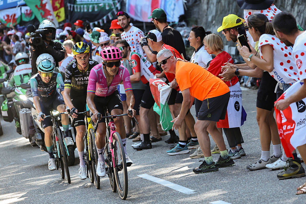 EF Education - EasyPost team's Ecuadorian rider Richard Carapaz, Team Visma | Lease a Bike's US rider Sepp Kuss and Bahrain - Victorious team's French rider Lenny Martinez cycle in the lead breakaway in the Alpe d'Huez ascent during the 19th stage of the 113th edition of the Tour de France cycling race, 127,9 km between Gap and Alpe d'Huez in the French Alps, on July 24, 2026. (Photo by Anne-Christine POUJOULAT / AFP)