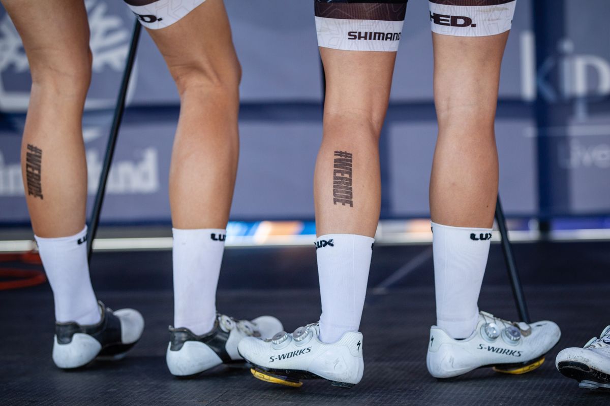 Riders stand on the morning sign-on before stage 1 of the Colorado Classic on August 22, 2019 in Steamboat Springs, Colorado.