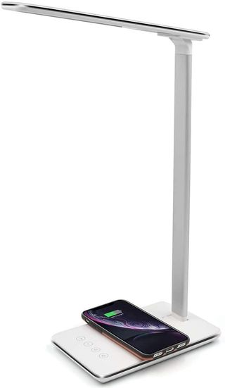 Santala Smart Led Desk Lamp with an iPhone on its wireless charing section