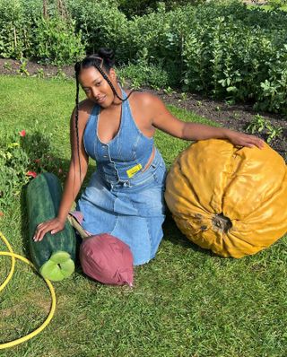 Imani Randolph wearing a denim halterneck top with a denim skirt.