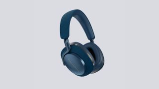 Bowers & Wilkins PX7 S2 in blue and gold showing side profile on a grey background