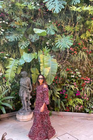 Byblos St Tropez Andrea Thompson in a red dress walking to dinner