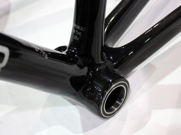 Oversized cartridge bearings are pressed directly into the carbon shell.