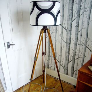 vintage tripod floor lamp on wooden floor