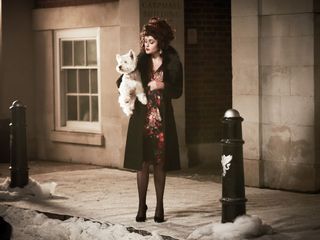 Helena Bonham Carter with a white dog in the new M&S Christmas advert